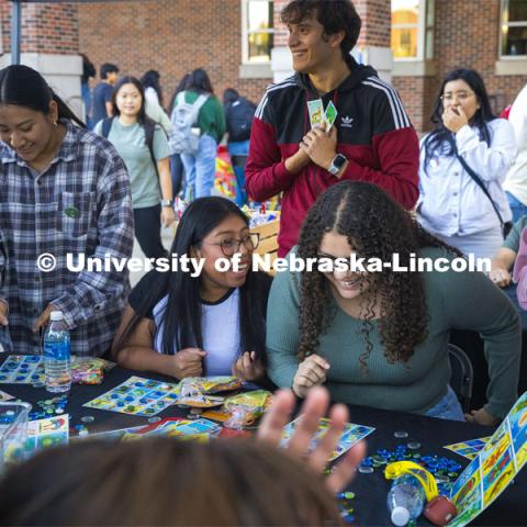 The Mexican American Student Association had an enthusiastic crowd at a large table playing Mexican Bingo. Students gathered around, waiting for their chance to try to fill a card for a prize. Fiesta on the green at the Nebraska Union Plaza. Fiesta on the Green is an annual Latino culture and heritage festival. October 5, 2023. Photo by Kristen Labadie / University Communication.